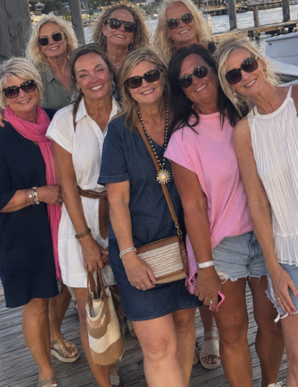 Eight friends together on a timber jetty