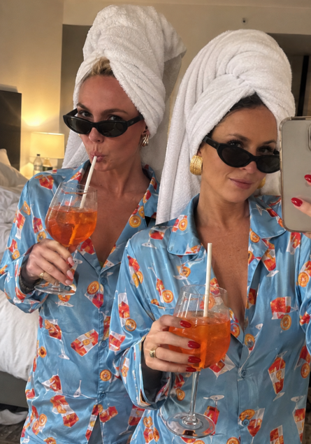 Sarah and a friend in matching pyjamas and towel turbans