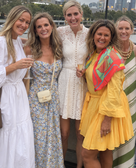 Tanya and friends in summer dresses by the river at dusk