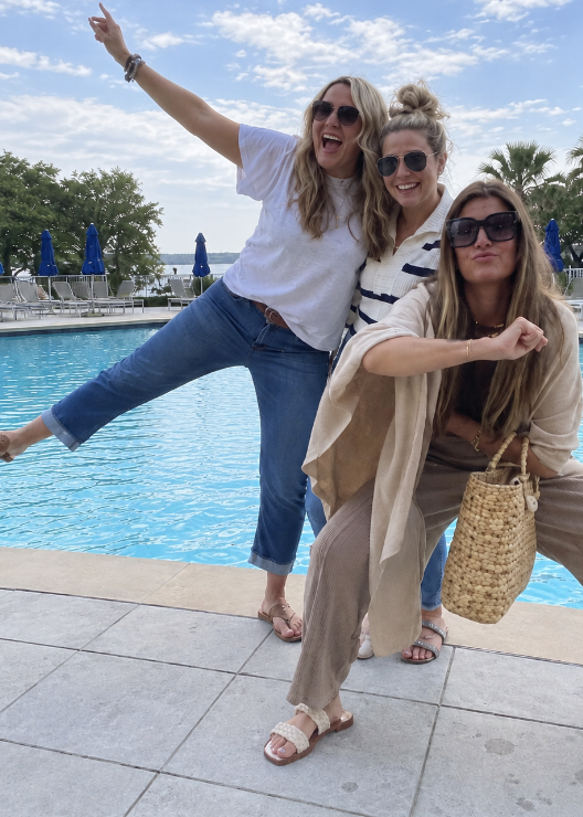 Kate and her friends larking about by a resort pool