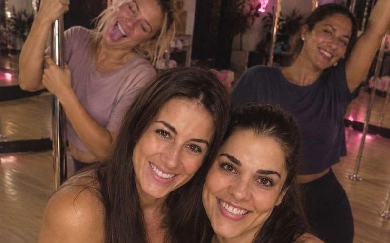 Friends laughing in a selfie at the pole studio after their class on a Sydney girls weekend