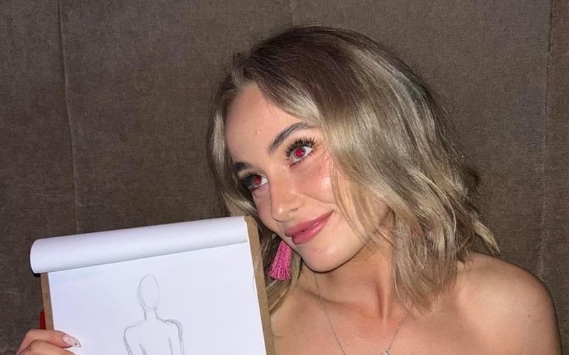A friend proudly holding up her life drawing sketch on a girls weekend in Melbourne
