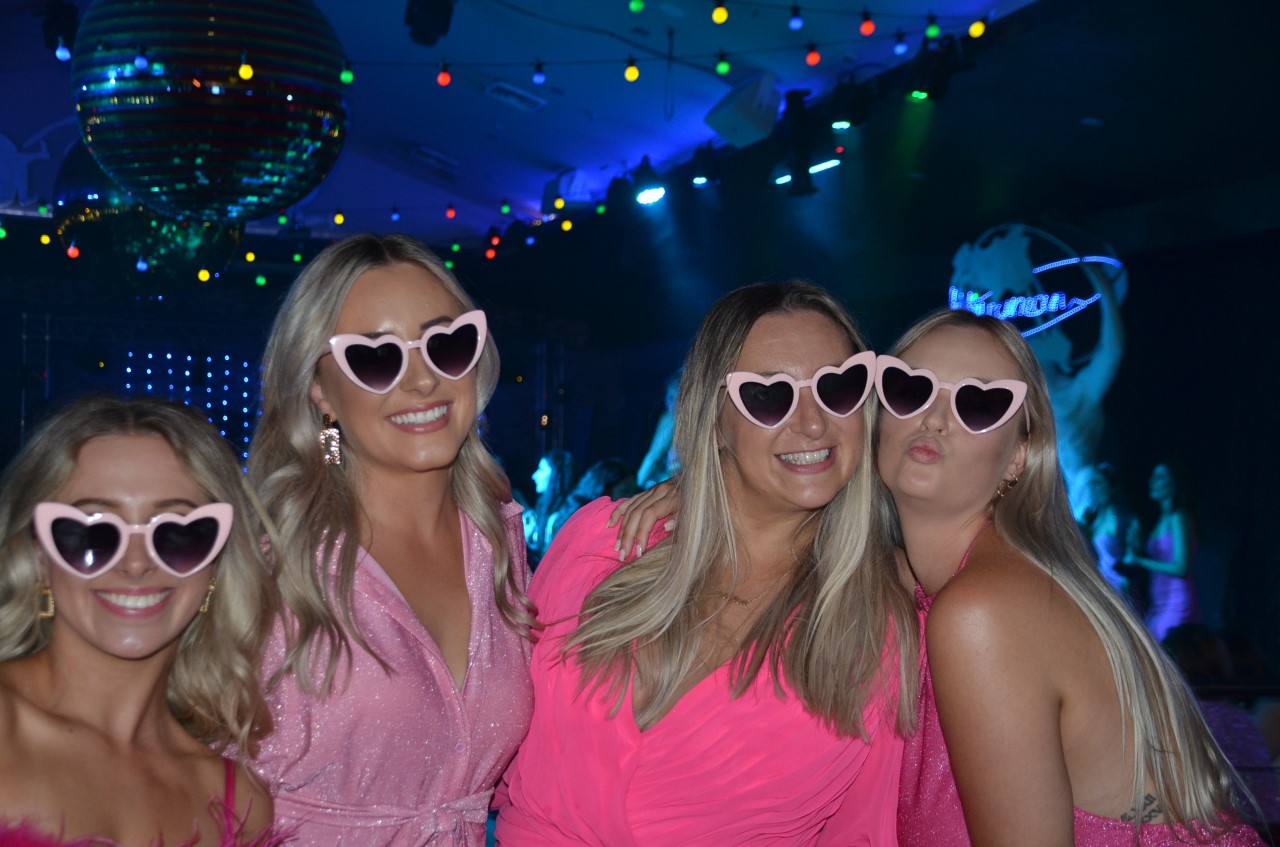 Photo sent in with this review: Four friends in pink heart-shaped sunglasses on a night out