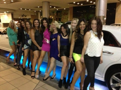 Photo sent in with this review: A big group of women dressed up for a night out, lined up beside a white stretch limousine
