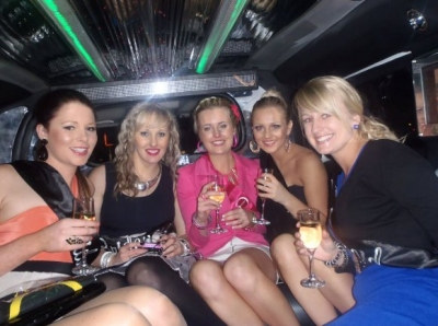 Photo sent in with this review: Five friends with glasses of bubbles inside a limousine