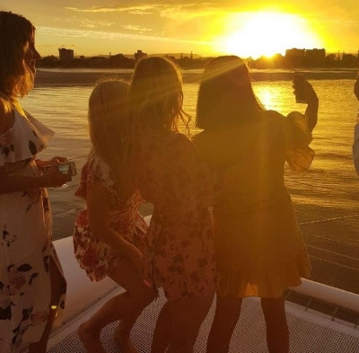 Photo sent in with this review: The girls silhouetted against a golden sunset on the water