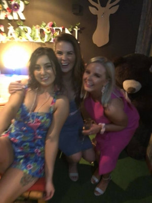 Photo sent in with this review: Three friends dressed up in a garden bar at night