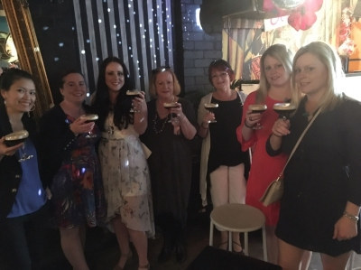 Photo sent in with this review: A group of women raising espresso martinis in a bar