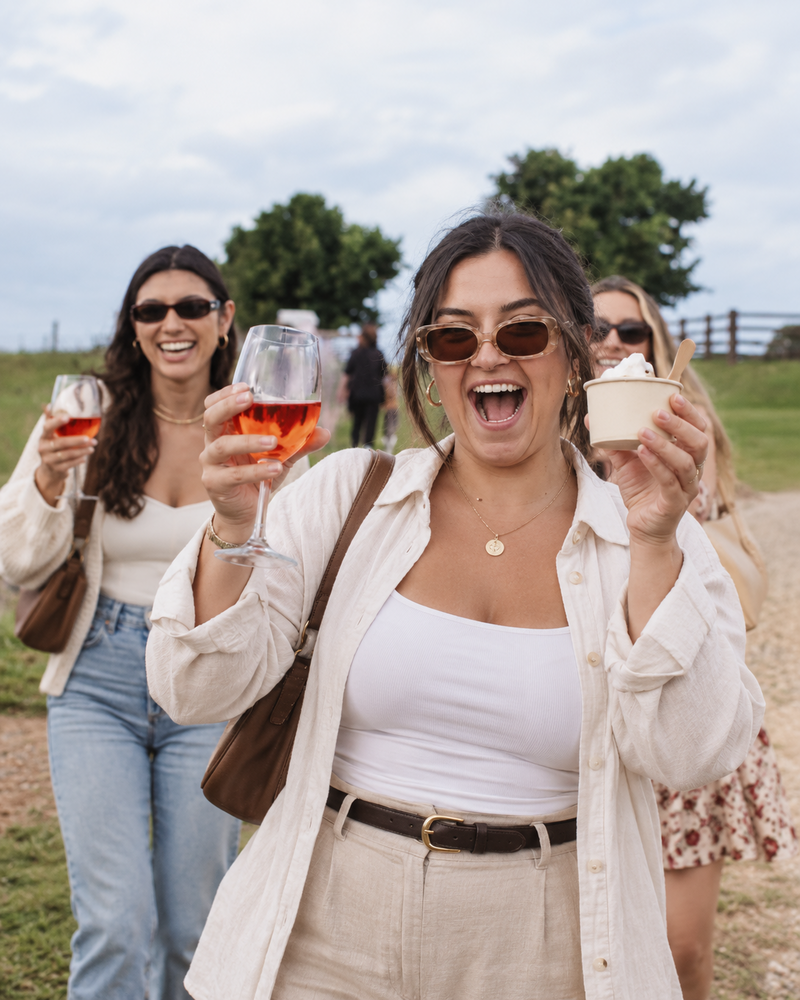 Friends tasting wine together on a Yarra Valley winery tour