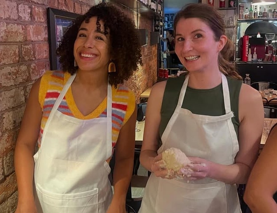 Friends in aprons at a gnocchi masterclass