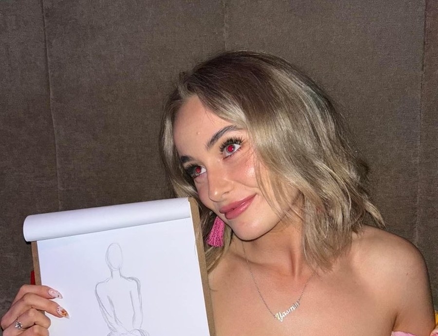 A friend proudly holding up her life drawing sketch